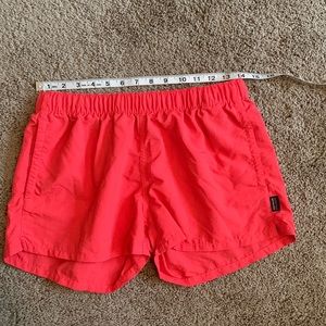 Patogonia shorts bright pinkish orange coral in color medium